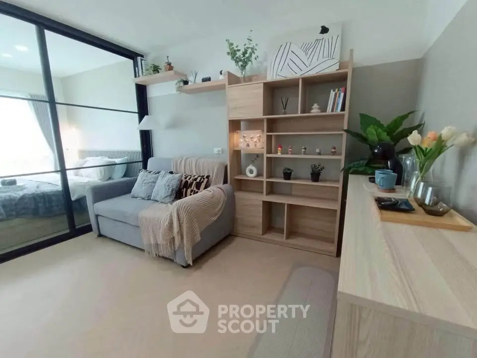 Modern living room with cozy sofa and stylish wooden shelving unit