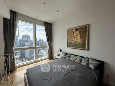 Modern bedroom with stunning city view and stylish decor