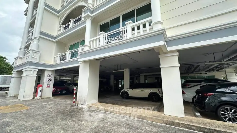 Spacious covered parking area in elegant residential building