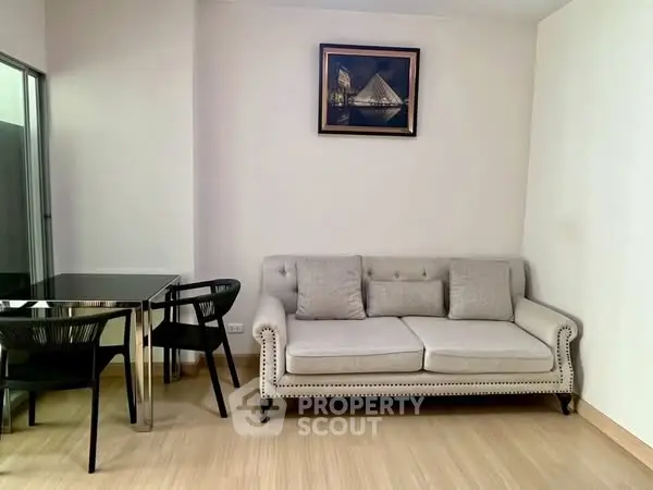 Chic living room with elegant sofa and modern dining set, perfect for urban living.