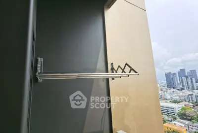 Modern balcony with city view and sleek metal drying rack