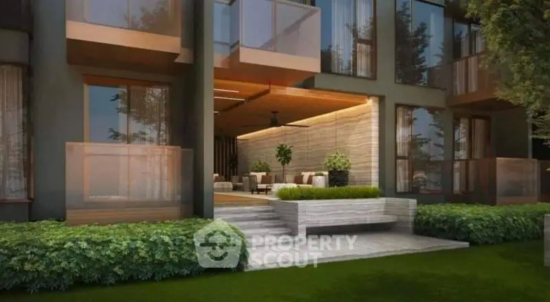 Modern building entrance with lush greenery and stylish design