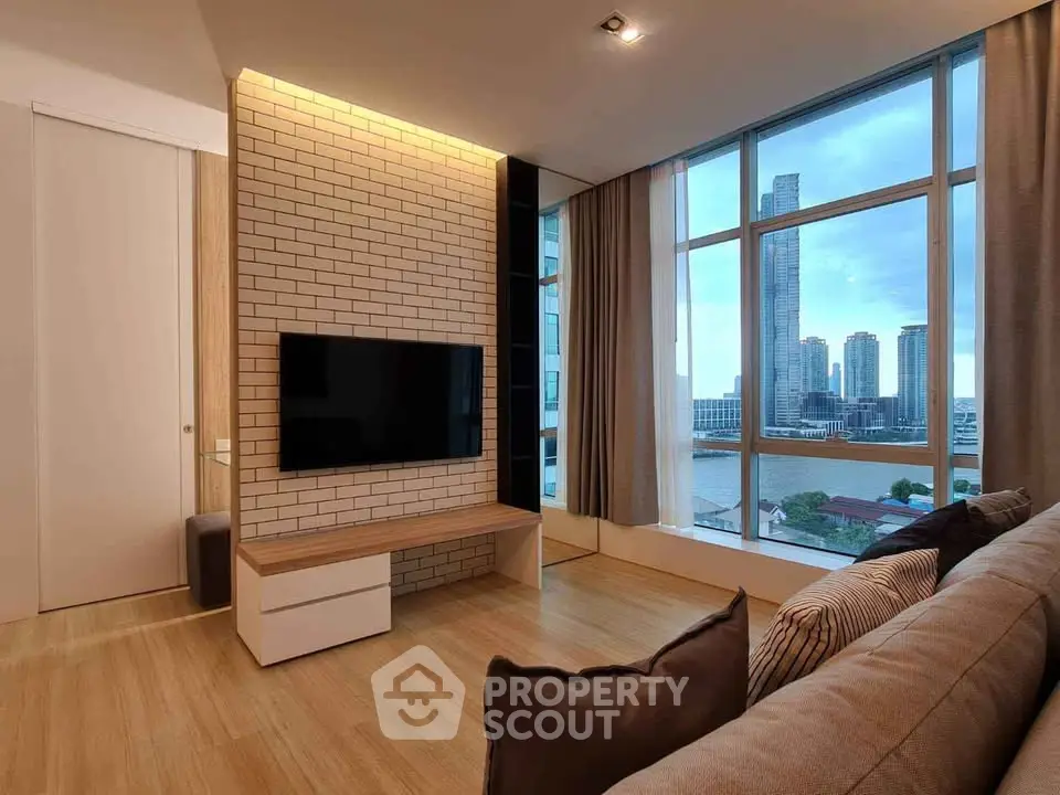 Modern living room with large windows offering stunning city skyline view, featuring sleek furniture and stylish decor.