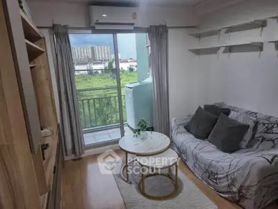 Cozy living room with balcony view in modern apartment