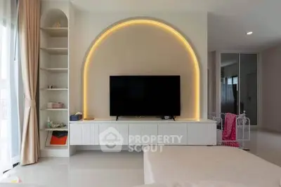 Modern living room with stylish TV unit and ambient lighting