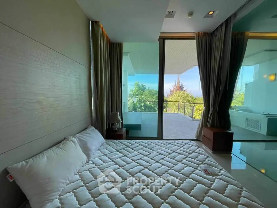 Luxurious bedroom with stunning balcony view and modern decor