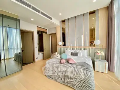 Luxurious modern bedroom with elegant decor and ample natural light