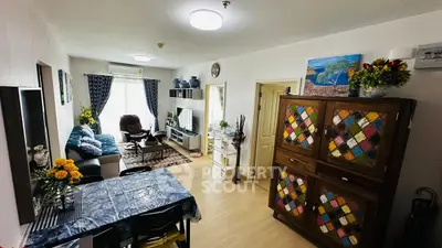 Spacious living room with colorful decor and modern furnishings