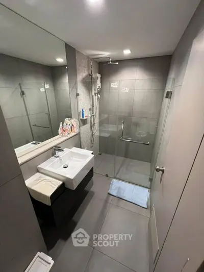 Modern bathroom with sleek design and glass shower enclosure