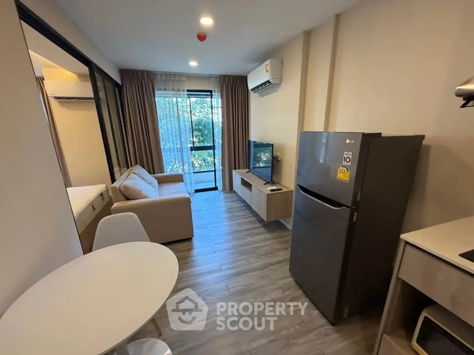 Modern living room with sleek furniture and large window view