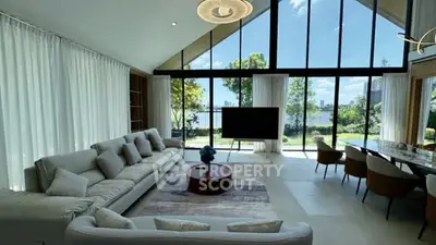 Luxurious living room with floor-to-ceiling windows and stunning lake view