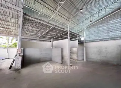 Spacious industrial warehouse with high ceilings and ample storage space.