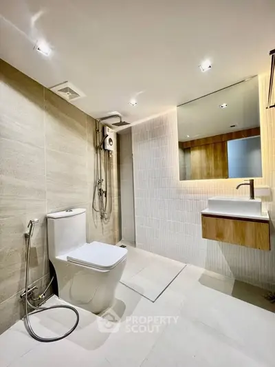 Modern bathroom with sleek fixtures and elegant lighting