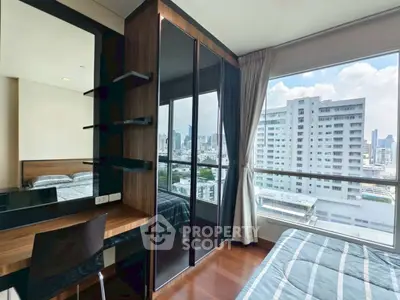 Modern bedroom with city view and stylish furniture
