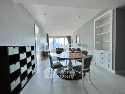 Spacious living room with elegant dining area and city view, perfect for modern urban living.