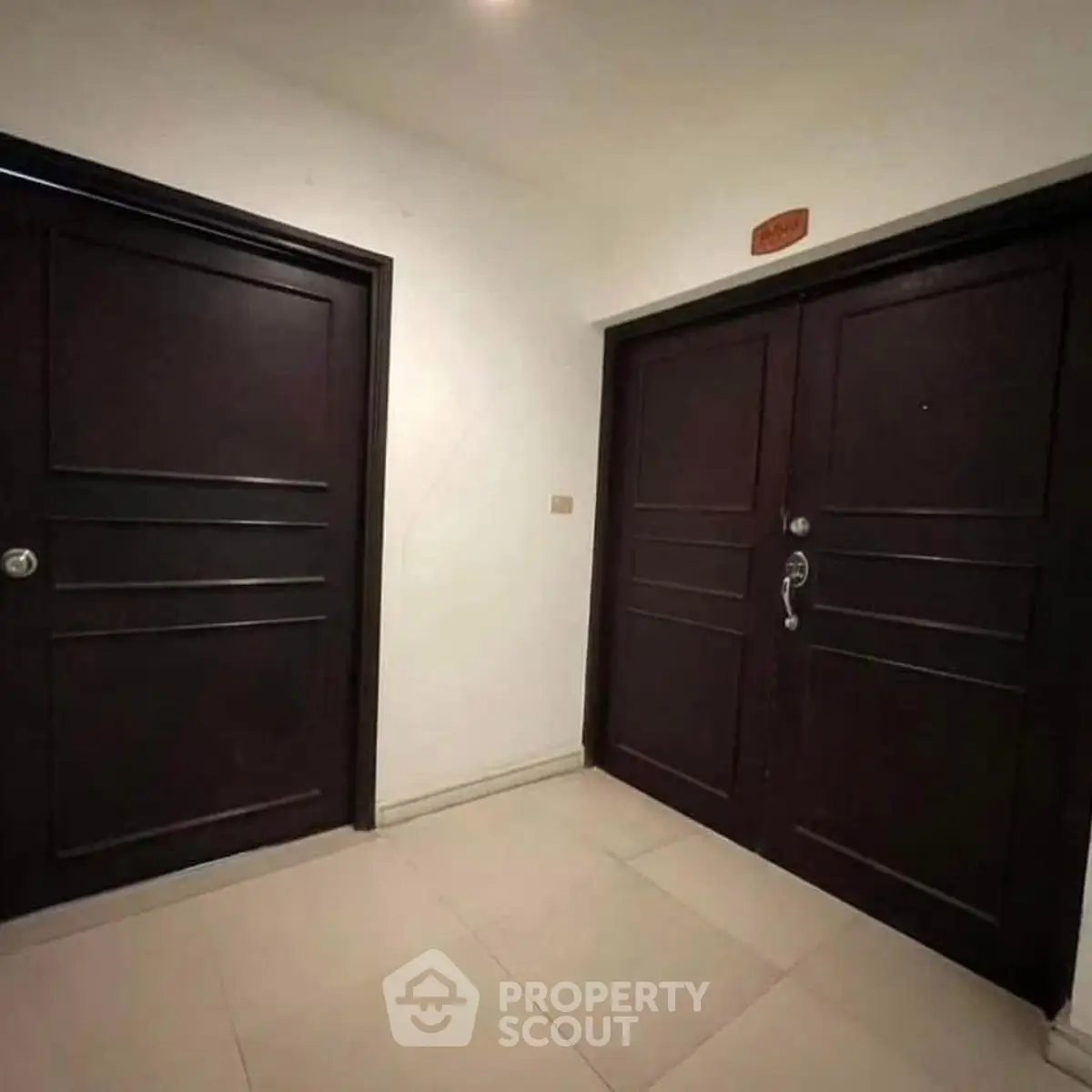 Elegant entrance with double doors and sleek design