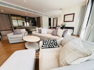 Luxurious modern living room with elegant furniture and open kitchen layout