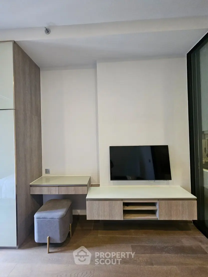 Modern living room with sleek TV unit and stylish furniture