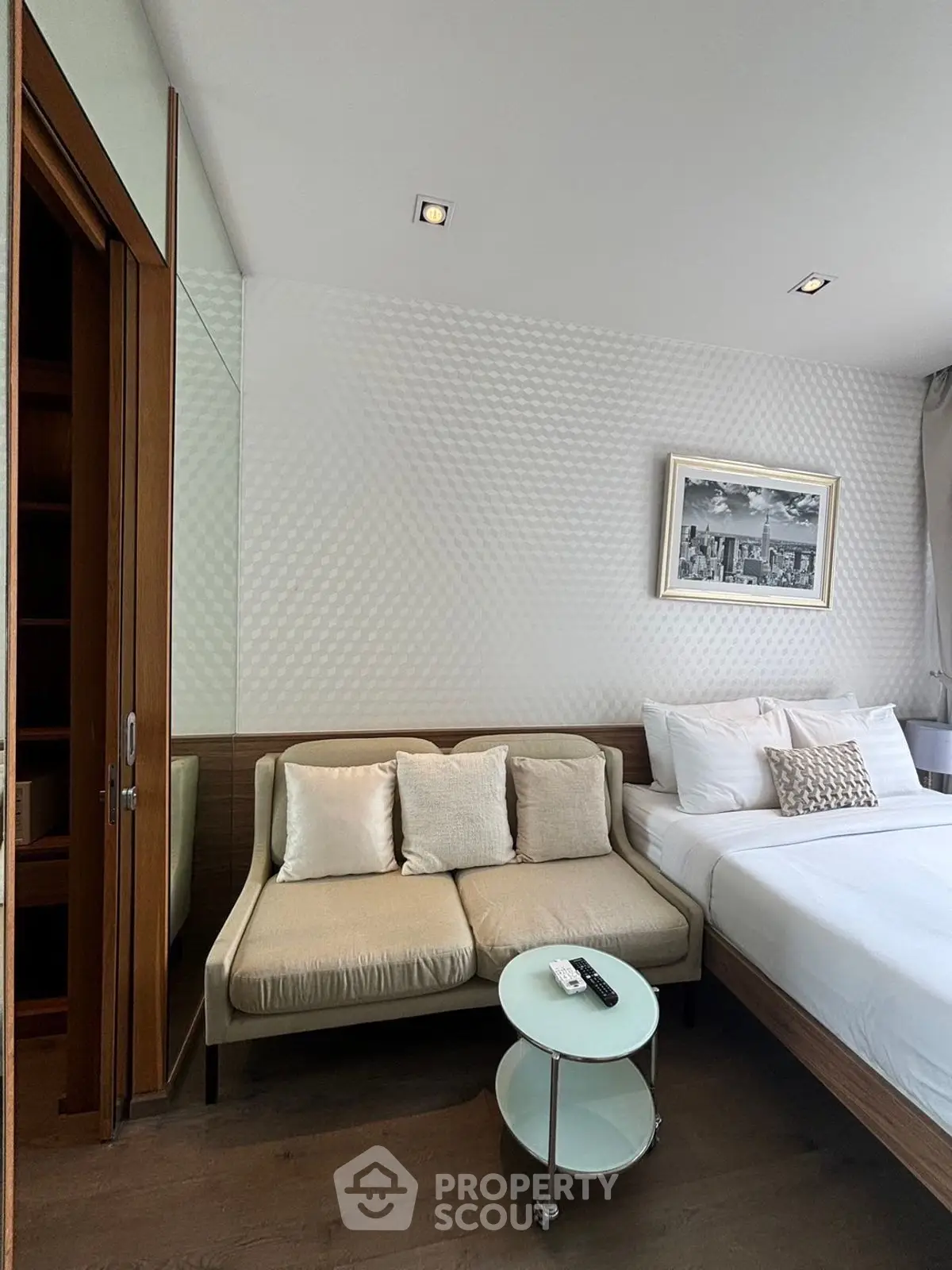 Modern bedroom with cozy sofa and stylish decor