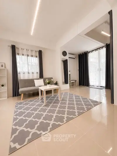 Spacious modern living room with elegant decor and natural light