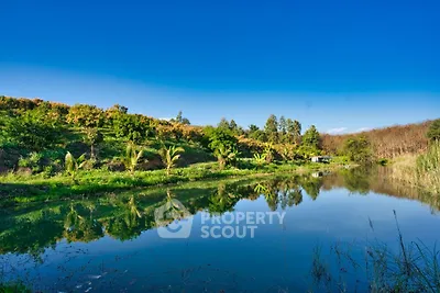 Stunning natural landscape with serene lake and lush greenery, perfect for tranquil living.