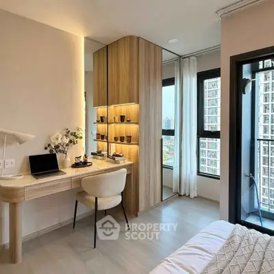 Modern bedroom with study area and balcony view in urban apartment