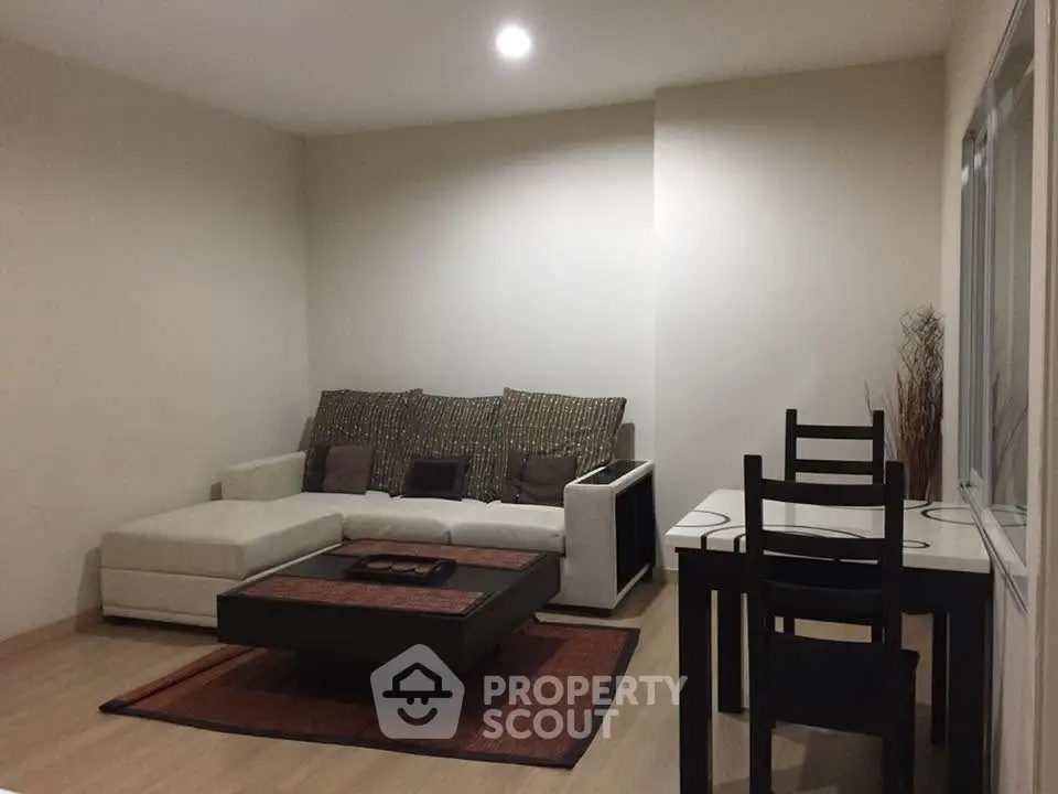Cozy living room with modern furniture and neutral decor, perfect for relaxation and entertaining.