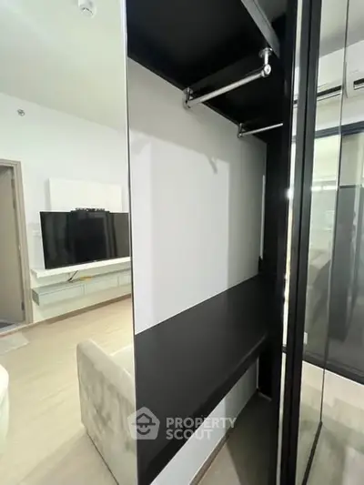 Modern living room with sleek TV unit and stylish storage space