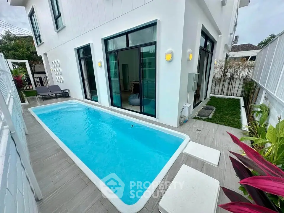 Modern villa with private pool and lush garden, perfect for luxury living.