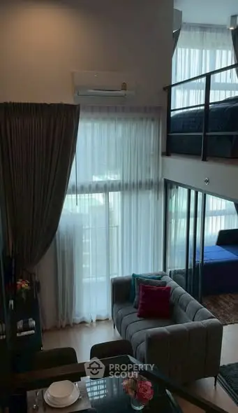 Modern loft apartment with stylish interior and large windows