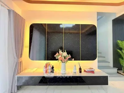 Modern living room with elegant black marble wall and stylish decor