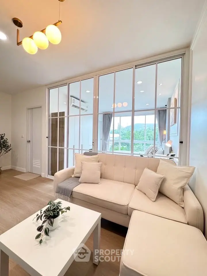 Bright and cozy living room with modern decor and large windows