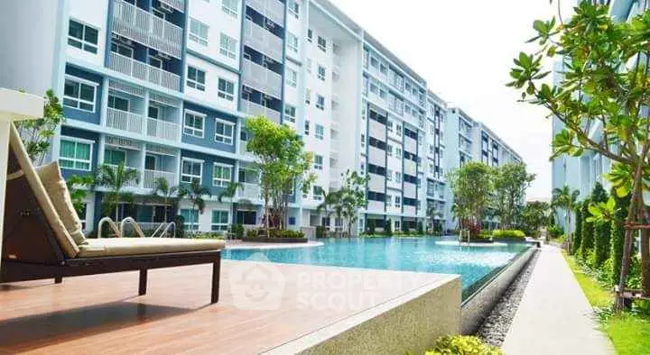 Modern apartment complex with luxurious swimming pool and lush greenery