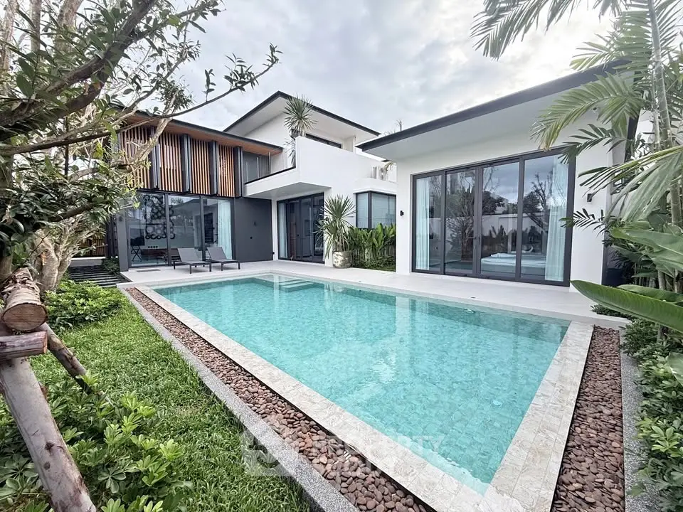Luxurious modern villa with private pool and lush garden, perfect for serene living.