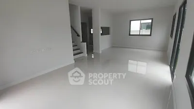 Spacious modern living room with glossy floors and large windows