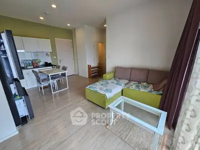 Modern living room with open kitchen and cozy seating area