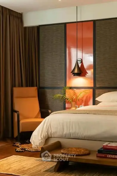 Luxurious bedroom with modern decor and stylish lighting, featuring a cozy armchair and elegant furnishings.