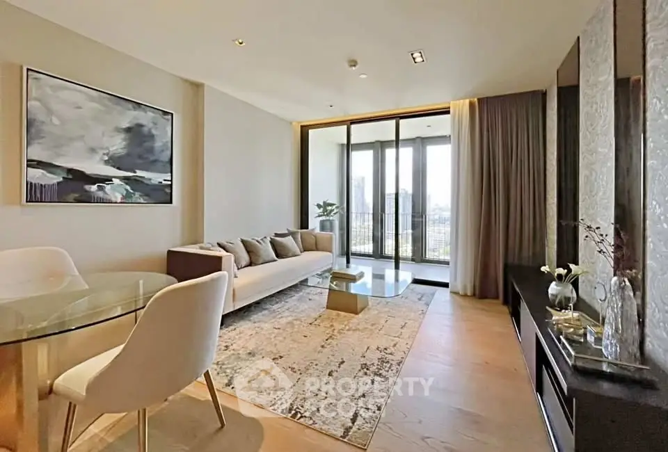 Modern living room with elegant decor and large windows offering a stunning city view.