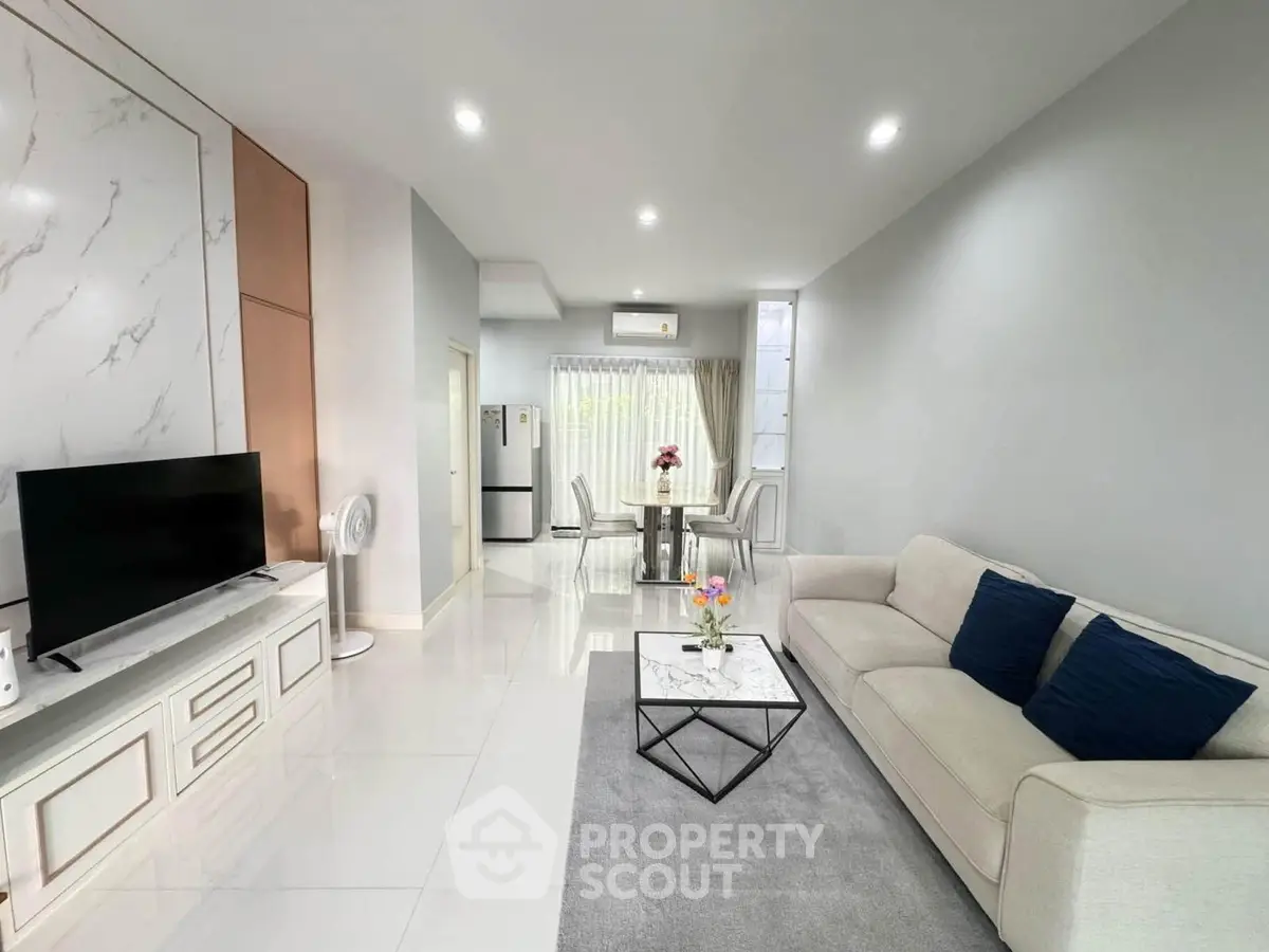 Modern living room with elegant decor, spacious layout, and natural light, perfect for comfortable living.