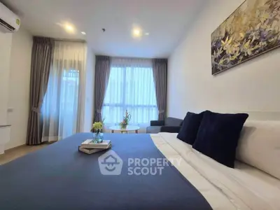 Modern bedroom with elegant decor and large windows in a stylish apartment
