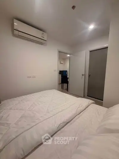 Cozy bedroom with air conditioning and modern decor in a stylish apartment.