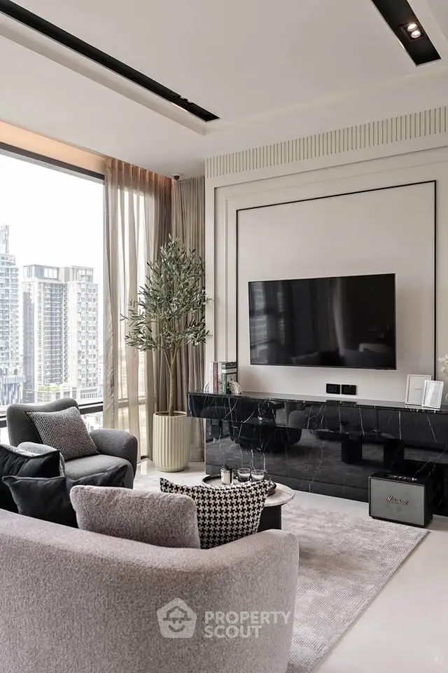Luxurious modern living room with city view, featuring sleek furniture and large TV.