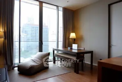 Modern study room with city view, featuring sleek furniture and large windows for natural light.