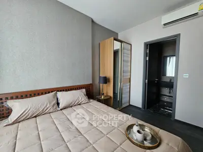 Modern bedroom with ensuite bathroom and stylish decor