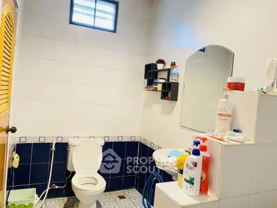 Cozy bathroom with modern fixtures and ample storage space, perfect for a refreshing start to your day.