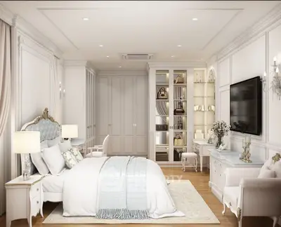 Luxurious bedroom with elegant decor, plush bedding, and stylish lighting in a sophisticated setting.