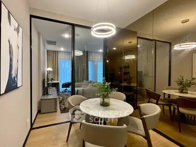 Modern dining area with elegant lighting and glass partitions in a stylish apartment.