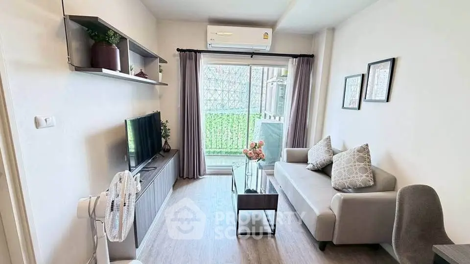 Modern living room with sleek furniture and natural light, perfect for relaxation and entertainment.