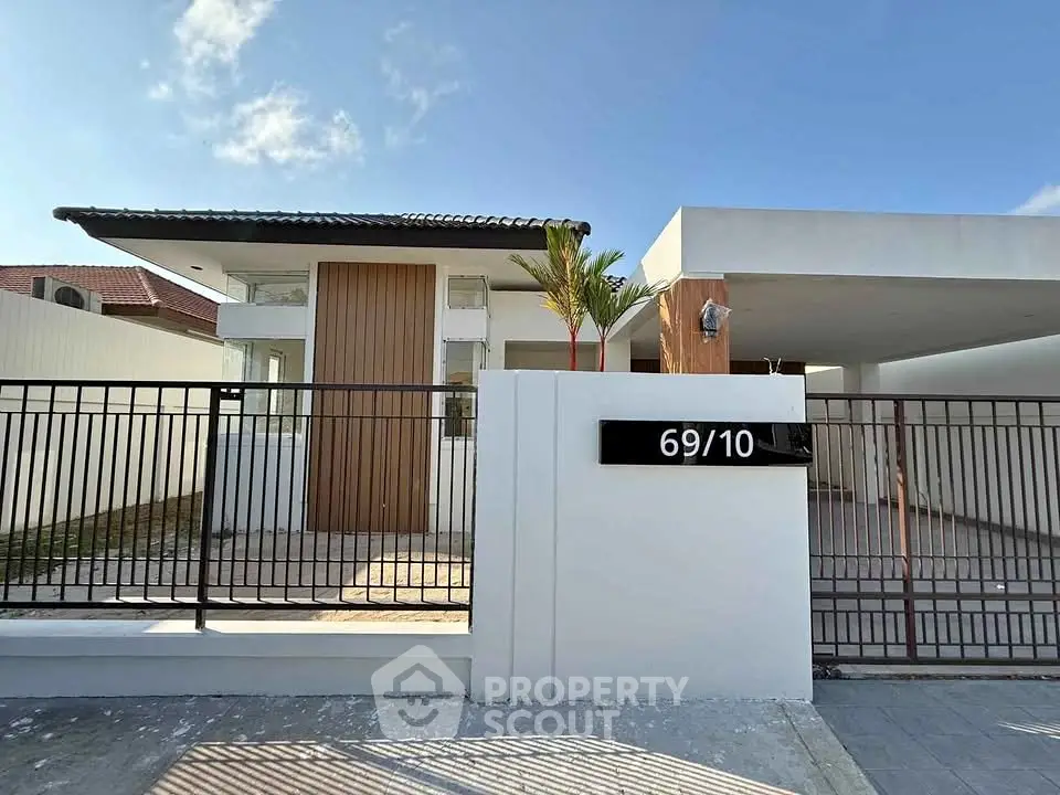 Modern minimalist house exterior with sleek design and spacious driveway