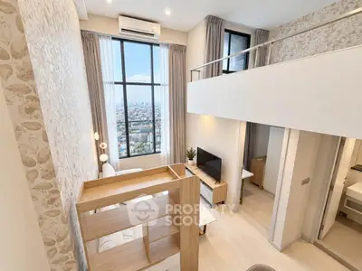 Modern loft apartment with high ceilings and city view, featuring stylish decor and ample natural light.